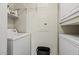 Functional laundry area with washer, dryer, shelving, and storage cabinet at 1701 E Colter St # 147, Phoenix, AZ 85016