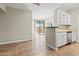 Open-concept living space with kitchen and balcony access for seamless indoor-outdoor living at 1701 E Colter St # 147, Phoenix, AZ 85016