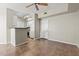 Bright living area with tile floors flowing into an efficient kitchen with white cabinets at 1701 E Colter St # 147, Phoenix, AZ 85016