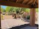 Backyard view highlights the desert landscaping with stone and a decorative wall in the distance at 17349 E Quail Ridge Dr, Fountain Hills, AZ 85268