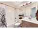 Cozy bathroom with shower-tub combo, bright lighting, vanity and decorative mirror at 17349 E Quail Ridge Dr, Fountain Hills, AZ 85268