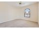 Spacious carpeted bedroom with a ceiling fan and a large window offering plenty of natural light at 17349 E Quail Ridge Dr, Fountain Hills, AZ 85268