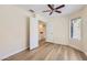 Bedroom with light walls and light-colored floors, with a ceiling fan and view to the hall at 17349 E Quail Ridge Dr, Fountain Hills, AZ 85268