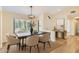Well-lit dining room with a modern table, stylish chairs, and contemporary light fixture at 17349 E Quail Ridge Dr, Fountain Hills, AZ 85268