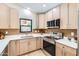 This modern kitchen boasts stainless steel appliances, bright countertops and light wood cabinets at 17349 E Quail Ridge Dr, Fountain Hills, AZ 85268