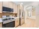 Well-equipped kitchen with stainless steel appliances and light wood cabinets at 17349 E Quail Ridge Dr, Fountain Hills, AZ 85268