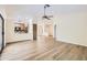 Bright, open-concept living space with wood floors, seamlessly connected to the kitchen area at 17349 E Quail Ridge Dr, Fountain Hills, AZ 85268