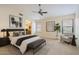 Spacious main bedroom suite with a large bed, sitting area, and ensuite bathroom at 17349 E Quail Ridge Dr, Fountain Hills, AZ 85268