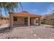 Covered patio area offers an outdoor retreat with pavers and serene desert landscaping at 17349 E Quail Ridge Dr, Fountain Hills, AZ 85268
