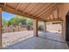 Charming covered patio with tiled flooring and stone accents, perfect for outdoor dining and relaxation at 17349 E Quail Ridge Dr, Fountain Hills, AZ 85268