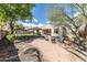 Expansive backyard with lush landscaping, seating area, and well-maintained lawn at 18149 W Turney Ave, Goodyear, AZ 85395