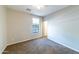 Clean, carpeted bedroom with natural light from the window and a ceiling fan for comfort at 18149 W Turney Ave, Goodyear, AZ 85395