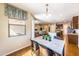 Inviting eat-in kitchen with a marble-top table, stylish chairs, and open view to the living area at 18149 W Turney Ave, Goodyear, AZ 85395