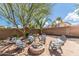 Relaxing backyard firepit area with comfortable seating for outdoor gatherings at 18149 W Turney Ave, Goodyear, AZ 85395