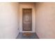 Inviting entryway showcasing a solid wood front door with a charming 'welcome' doormat at 18149 W Turney Ave, Goodyear, AZ 85395