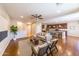 Open-concept living room featuring hardwood floors, comfortable seating, and seamless kitchen access at 18149 W Turney Ave, Goodyear, AZ 85395
