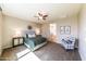 Spacious main bedroom with a ceiling fan, carpet, and stylish furnishings and decor at 18149 W Turney Ave, Goodyear, AZ 85395