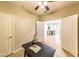 Bright office space with open doorway, ceiling fan, tiled floors, and a neat black desk at 18149 W Turney Ave, Goodyear, AZ 85395