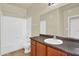 The bathroom features a large mirror and vanity with a sink, faucet, and cabinets at 1941 S Pierpont Dr # 1014, Mesa, AZ 85206