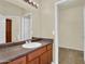 Bathroom featuring a large vanity mirror, neutral-toned walls, and a doorway to the closet space at 1941 S Pierpont Dr # 1014, Mesa, AZ 85206