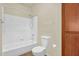 A tiled tub and toilet within a full bathroom at 1941 S Pierpont Dr # 1014, Mesa, AZ 85206