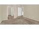 The bedroom has neutral walls and carpet and two entry doors at 1941 S Pierpont Dr # 1014, Mesa, AZ 85206