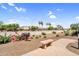 Outdoor community area featuring desert landscaping, seating, and a barbecue grill at 1941 S Pierpont Dr # 1014, Mesa, AZ 85206