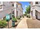 Condominium exterior showcasing well-maintained landscaping and clear signage, promoting a pet-friendly community at 1941 S Pierpont Dr # 1014, Mesa, AZ 85206