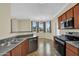 This open-concept kitchen features a stainless steel oven, range, microwave, and dishwasher at 1941 S Pierpont Dr # 1014, Mesa, AZ 85206