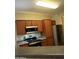 Kitchen features stainless steel appliances, wooden cabinets, and tile backsplash at 1941 S Pierpont Dr # 1014, Mesa, AZ 85206