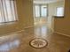 Bright living room featuring tile floors and large windows with decorative star in the center at 1941 S Pierpont Dr # 1014, Mesa, AZ 85206