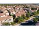 An aerial view of a neighborhood featuring well-maintained homes, mature trees and beautiful tile roofs at 1941 W Yellowstone Way, Chandler, AZ 85248