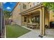 Covered outdoor dining space featuring pavers and easy access to green backyard at 1941 W Yellowstone Way, Chandler, AZ 85248