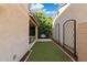 Charming backyard with artificial turf, patio, and a cozy outdoor seating area surrounded by lush greenery at 1941 W Yellowstone Way, Chandler, AZ 85248