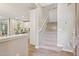 Inviting entryway with hardwood floors, a staircase, and a glimpse of the kitchen at 1941 W Yellowstone Way, Chandler, AZ 85248