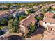 Beautiful two-story home with a red tile roof, brick driveway, mature landscaping, and a two-car garage at 1941 W Yellowstone Way, Chandler, AZ 85248