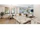 Open concept kitchen and dining area with granite island, modern lighting, and lots of natural light at 1941 W Yellowstone Way, Chandler, AZ 85248