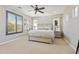 Bright bedroom with plantation shutters, a ceiling fan, and neutral decor for a relaxing ambiance at 1941 W Yellowstone Way, Chandler, AZ 85248