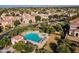 Aerial view of community pool and lounge area surrounded by lush landscaping and mature trees at 1941 W Yellowstone Way, Chandler, AZ 85248