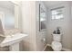 Cozy powder room with a pedestal sink, toilet, and a framed art piece at 1941 W Yellowstone Way, Chandler, AZ 85248