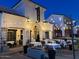 Inviting restaurant exterior at twilight, featuring outdoor seating and soft lighting at 1941 W Yellowstone Way, Chandler, AZ 85248