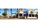 Exterior view of Rock Lobster restaurant, offering a vibrant atmosphere with blue awnings and ample parking at 1941 W Yellowstone Way, Chandler, AZ 85248