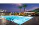 Sparkling community pool with clear blue water, palm trees, and comfortable lounge areas for relaxation and enjoyment at 1941 W Yellowstone Way, Chandler, AZ 85248