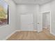 Bright bedroom features hardwood floors and a closet with sliding doors at 19550 N Grayhawk Dr # 1144, Scottsdale, AZ 85255