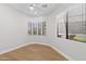 Bedroom with hardwood floors, bright windows, and a ceiling fan at 19550 N Grayhawk Dr # 1144, Scottsdale, AZ 85255