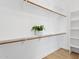 Spacious walk-in closet with custom shelving and ample storage space at 19550 N Grayhawk Dr # 1144, Scottsdale, AZ 85255