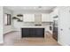 Well-equipped kitchen with black island and stainless steel appliances at 19550 N Grayhawk Dr # 1144, Scottsdale, AZ 85255