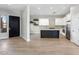 Spacious kitchen with black island, white cabinets, and stainless steel appliances at 19550 N Grayhawk Dr # 1144, Scottsdale, AZ 85255