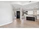 Open living space featuring a modern kitchen and dark wood entry door at 19550 N Grayhawk Dr # 1144, Scottsdale, AZ 85255