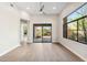 Bright living room with large window and sliding glass door, offering beautiful outdoor views at 19550 N Grayhawk Dr # 1144, Scottsdale, AZ 85255